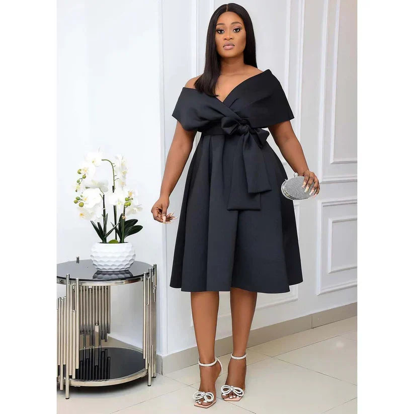 Robe élégante femme coupe A-ligne à manches courtes, parfaite pour soirée ou tenue chic. Style moderne printemps/été.