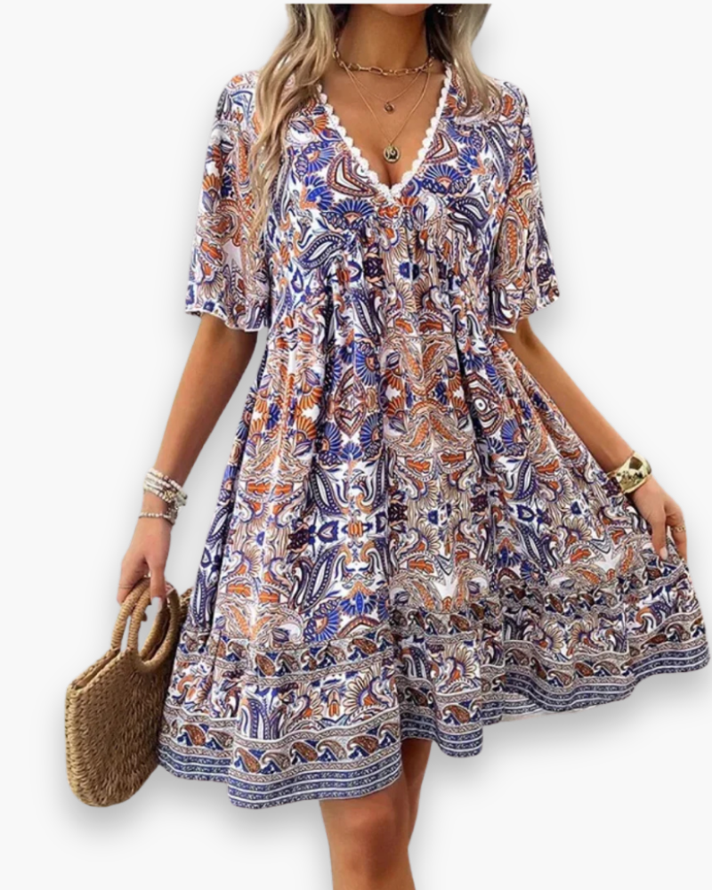 Robe midi femme style bohème chic, fluide et légère. Idéale pour un look décontracté et élégant d'été.