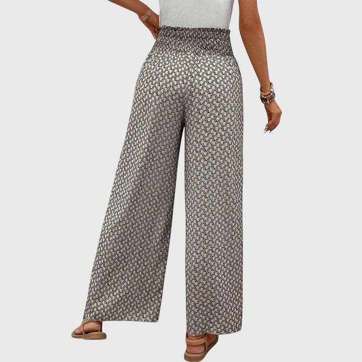 Pantalon palazzo fluide femme, taille haute. Silhouette élégante, confort optimal au quotidien.