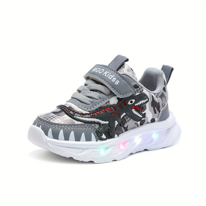 Semelle antidérapante des baskets de sport LED dinosaures pour garçons. Chaussures lumineuses confortables et sûres.
