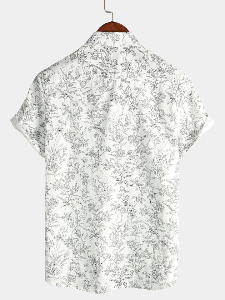 Chemise tropicale homme colorée, manches courtes, boutonnée, look estival et décontracté.