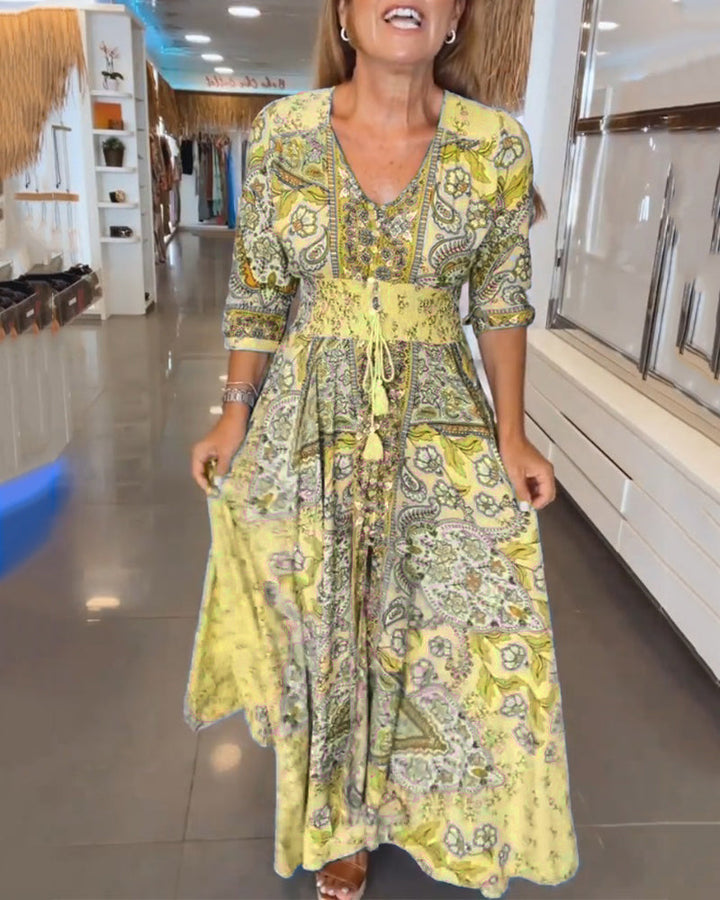 Robe maxi chic femme, imprimé floral discret, col V, taille ajustable. Pour toutes occasions.