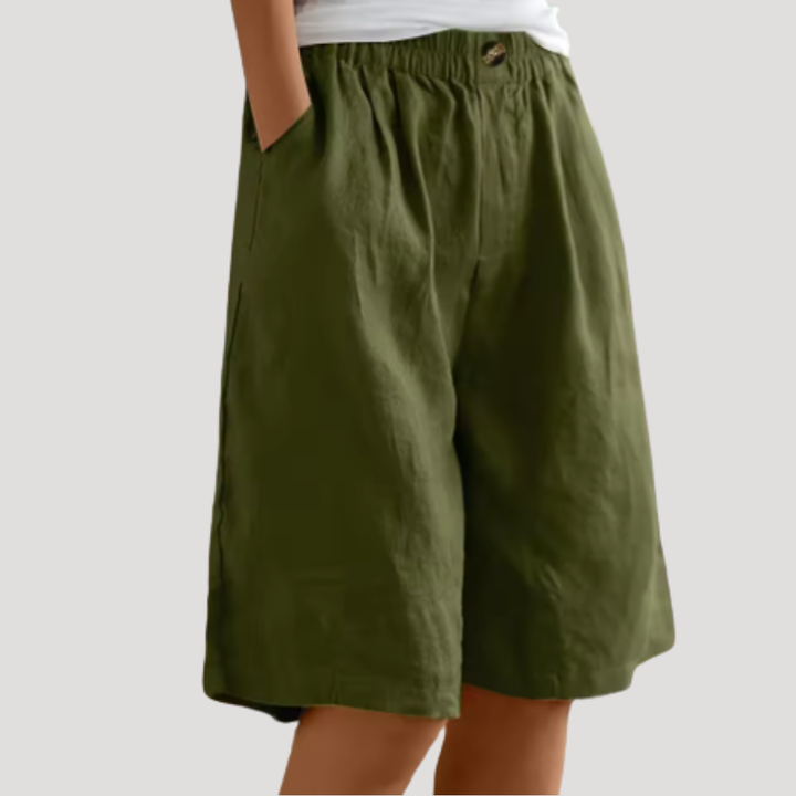 Bermuda femme chic, taille élastique, coupe ample et fluide. Idéal pour un style d'été décontracté et confortable.