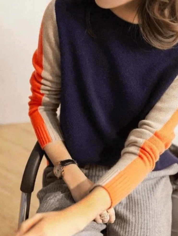 Pull femme rayé élégant, style graphique chic, vêtement mode féminine pour une tenue raffinée et confortable.