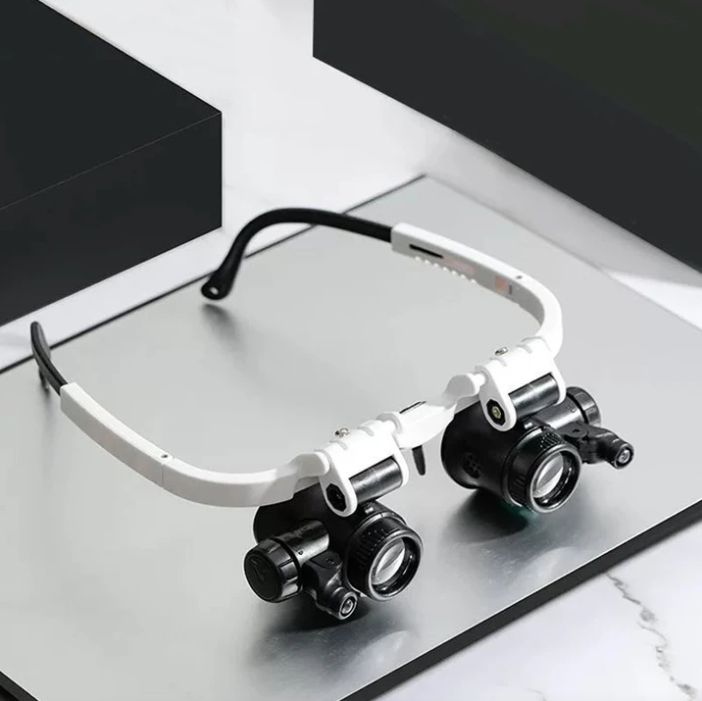 Lunettes loupe HD professionnelles avec éclairage LED, idéales pour travaux de précision en horlogerie ou modélisme.
