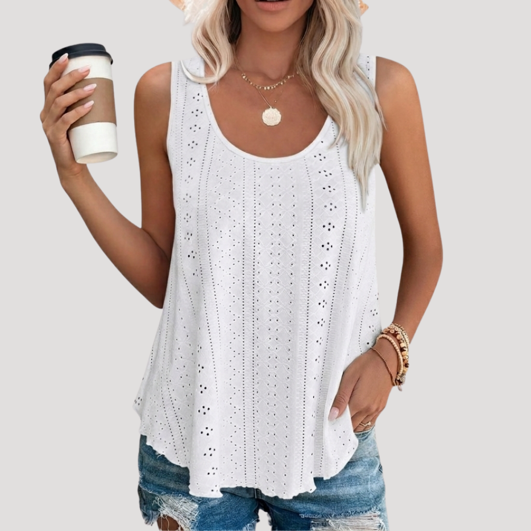 Débardeur femme fluide estival blanc avec délicate broderie anglaise, idéal pour la mode été.