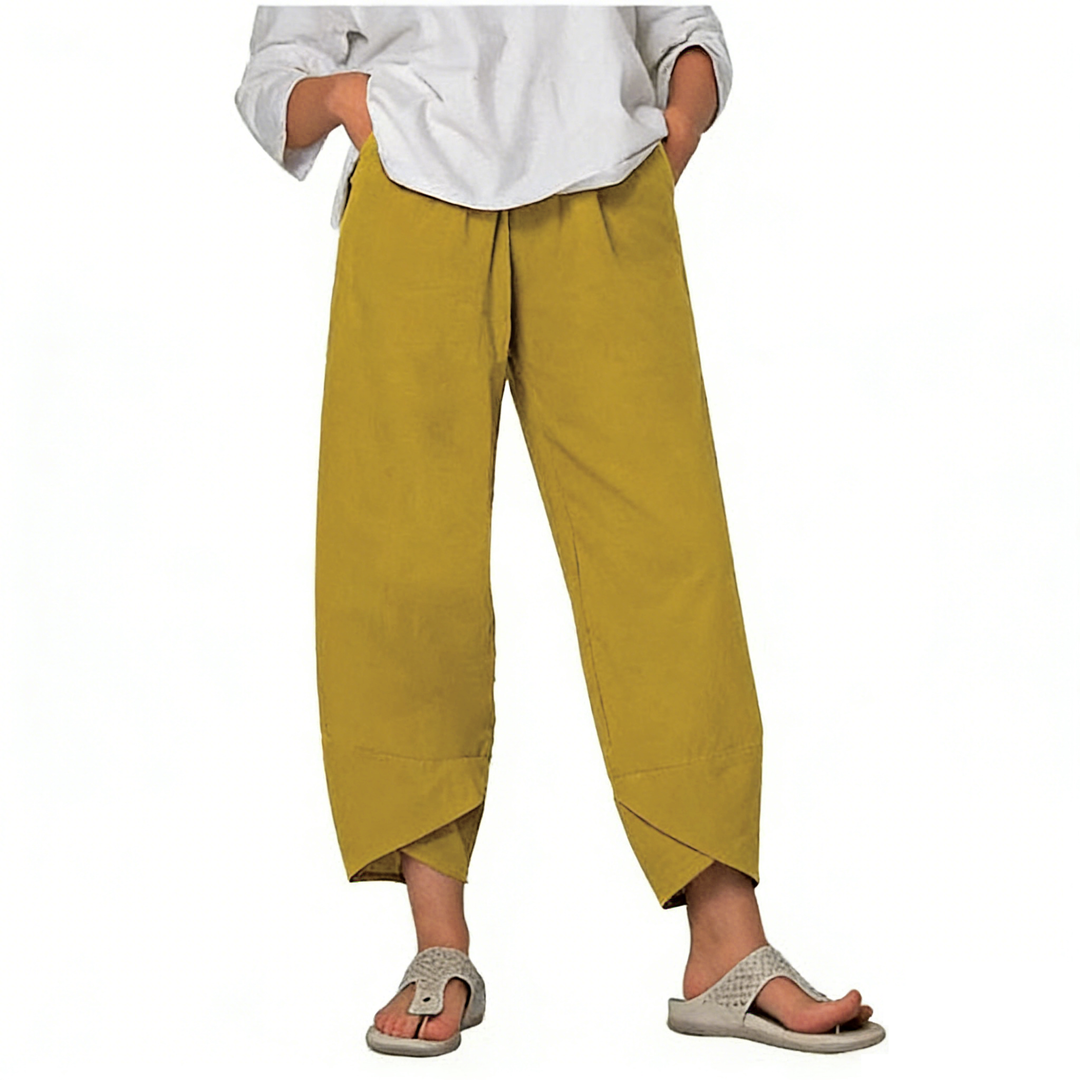 Pantalon fluide asymétrique femme vintage, taille haute et poches discrètes, un essentiel pour l'été.