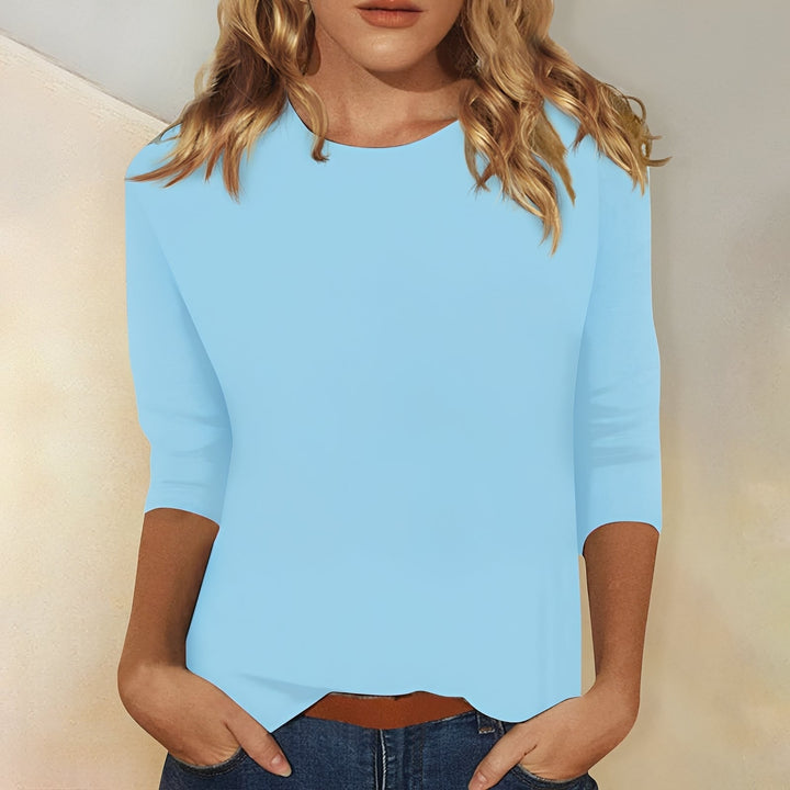 T-shirt femme décontracté à manches 3/4, coupe ample pour confort quotidien et look casual printemps-été.