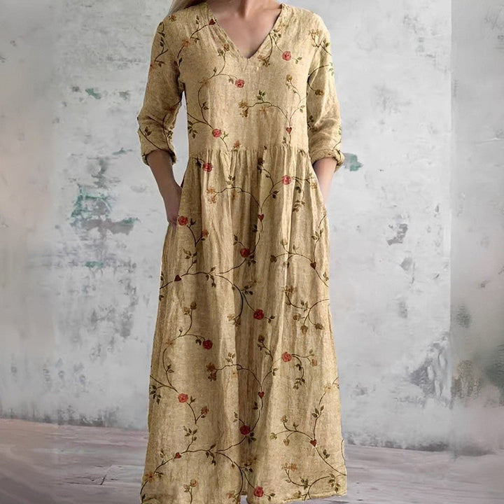 Robe maxi bohème femme en coton, col V, manches longues, imprimé floral et poches. Idéale pour l'été décontracté.
