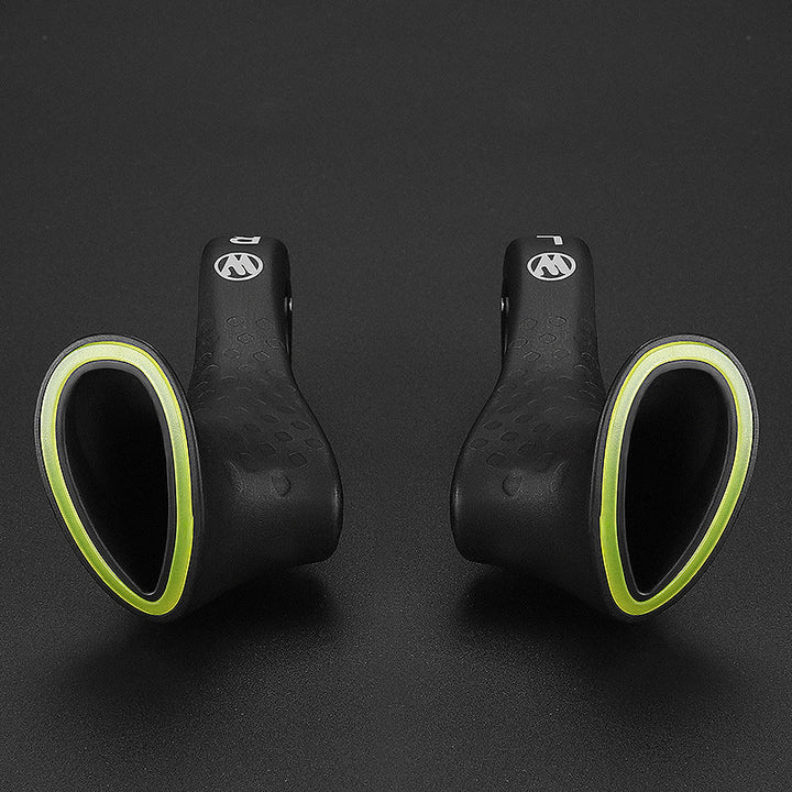Poignées vélo noires robustes, design ergonomique pour réduire la douleur et améliorer le confort cycliste.
