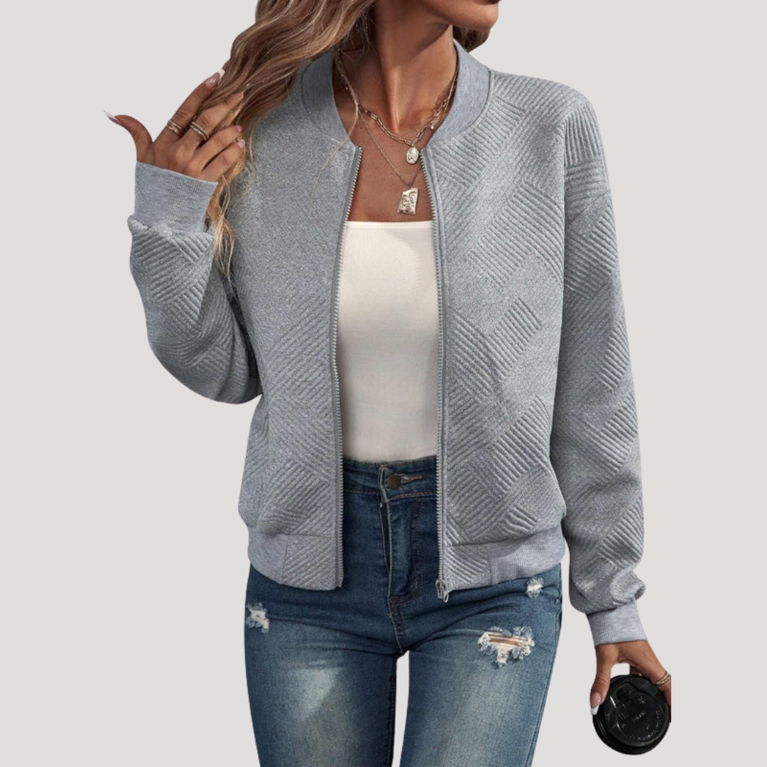 Blouson bomber femme texturé, élégant et décontracté. Idéal pour un style urbain féminin, finitions côtelées.