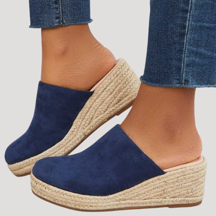 Mules compensées femme élégantes style espadrille, parfaites pour l'été. Confort et mode estivale assurés.