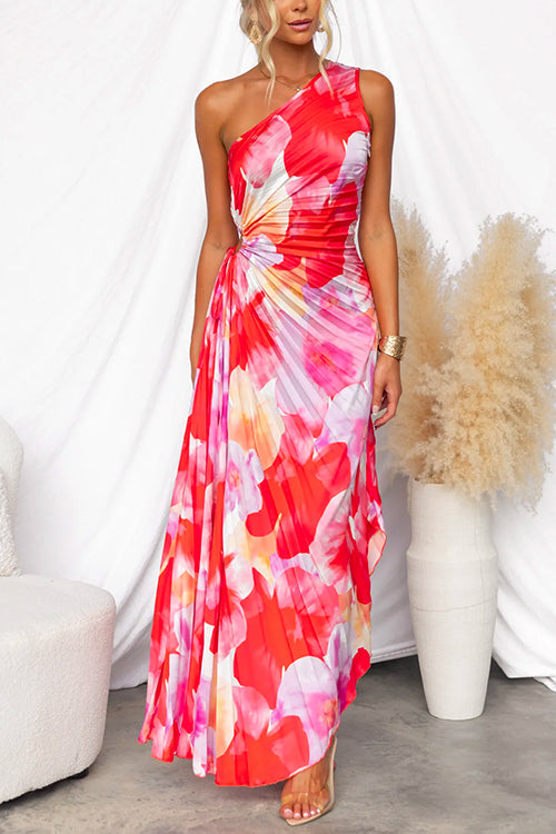 Robe femme asymétrique plissée fleurie rose, idéale pour l'été. Tenue chic et confortable pour la mode estivale.