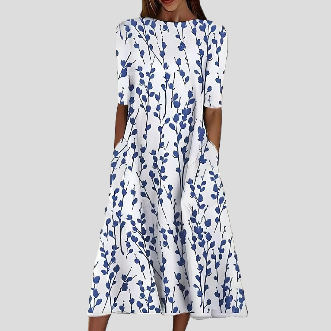 Robe midi fleurie femme en coton, manches courtes, style bohème élégant. Parfaite pour l'été.