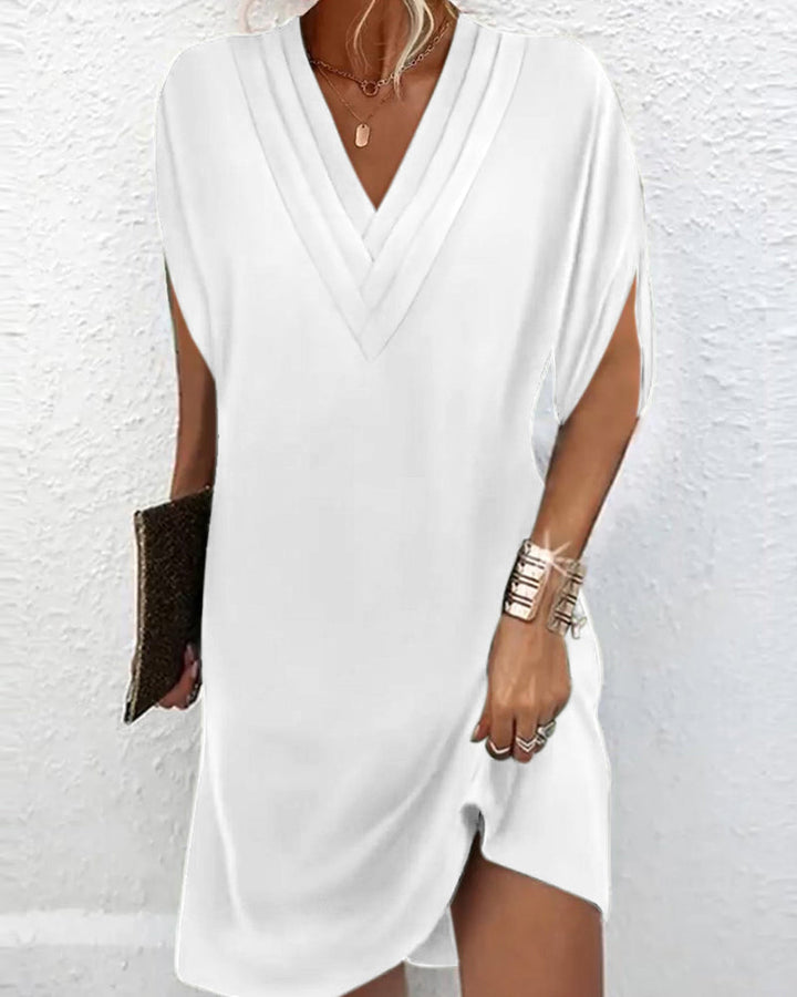 Robe chic unie avec manches fendues, idéale pour un look mode femme du printemps.