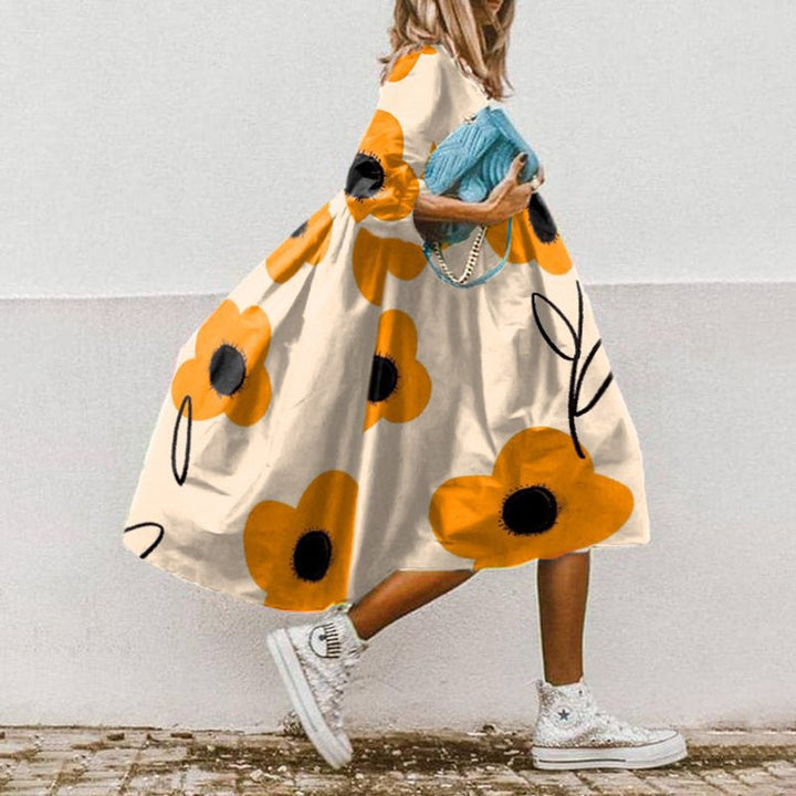 Robe de plage femme mi-longue printanière, décontractée et chic, idéale pour les escapades ensoleillées.
