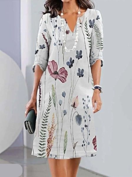 Robe midi fleurie pour femme, design superposé élégant. Parfaite pour le printemps/été en bleu marine, gris clair ou blanc cassé.