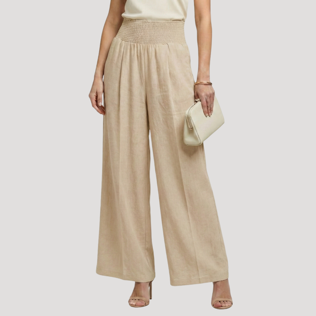 Pantalon femme fluide taille smockée, jambes larges élégantes, parfait pour l'été et le confort.