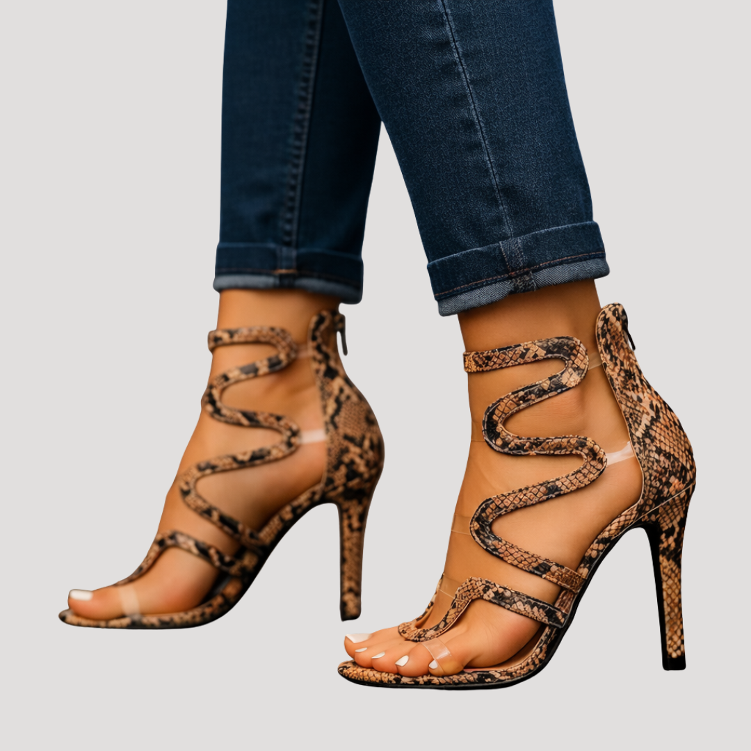 Sandales femme noires à talons hauts, lanières serpent, pour un look soirée élégant et moderne.