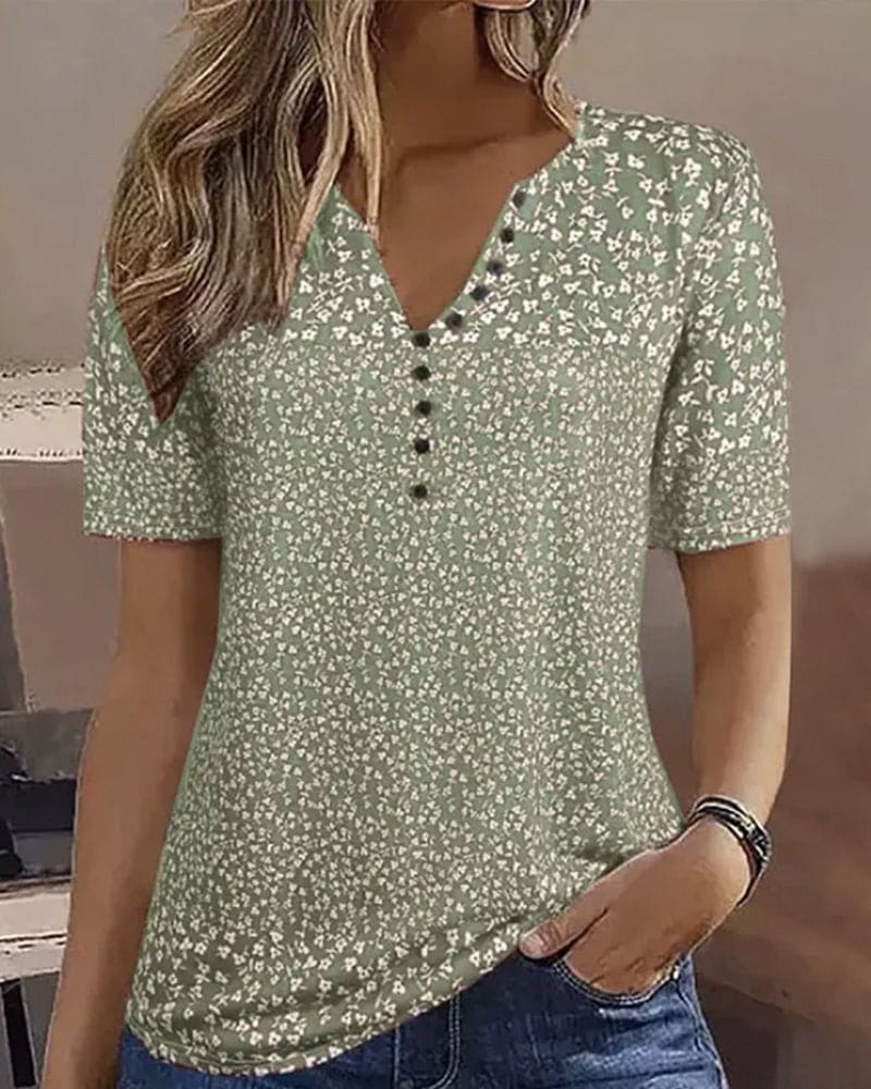 Haut femme stretch à imprimé floral vibrant, confortable pour l'été. Style décontracté et féminin.