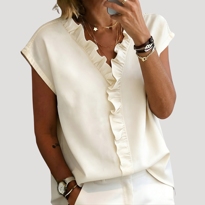 Blouse femme chic à volants, manches courtes, parfaite pour l'été et les tenues décontractées élégantes.