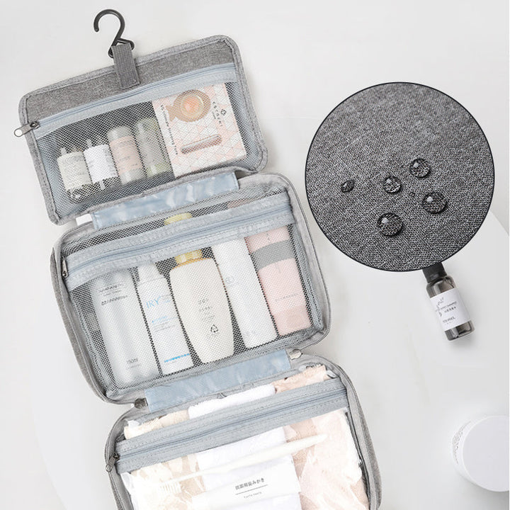 Trousse cosmétique étanche, design moderne et unisexe, pour un rangement impeccable en voyage.