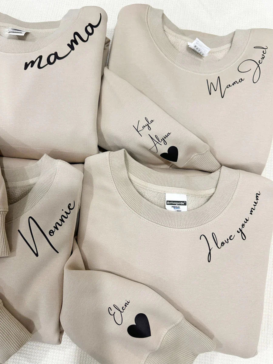 Pull à capuche unisexe personnalisable avec prénoms gravés. Cadeau idéal et confortable pour elle et lui, mode unisexe.
