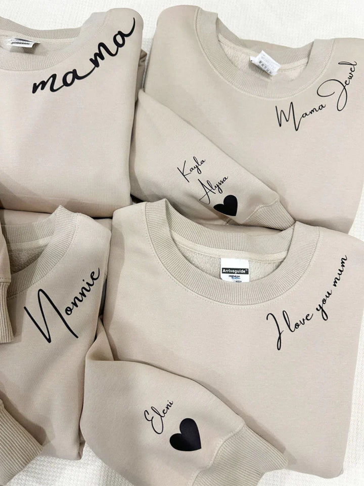 Pull à capuche unisexe personnalisable avec prénoms gravés. Cadeau idéal et confortable pour elle et lui, mode unisexe.