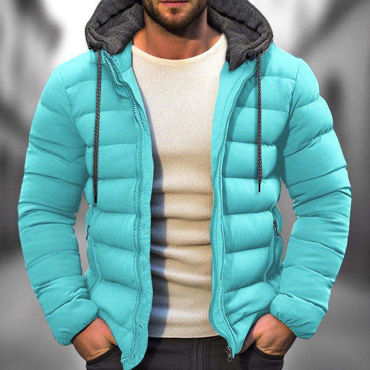 Veste homme hiver matelassée noire avec capuche, idéale pour le froid et le style décontracté.