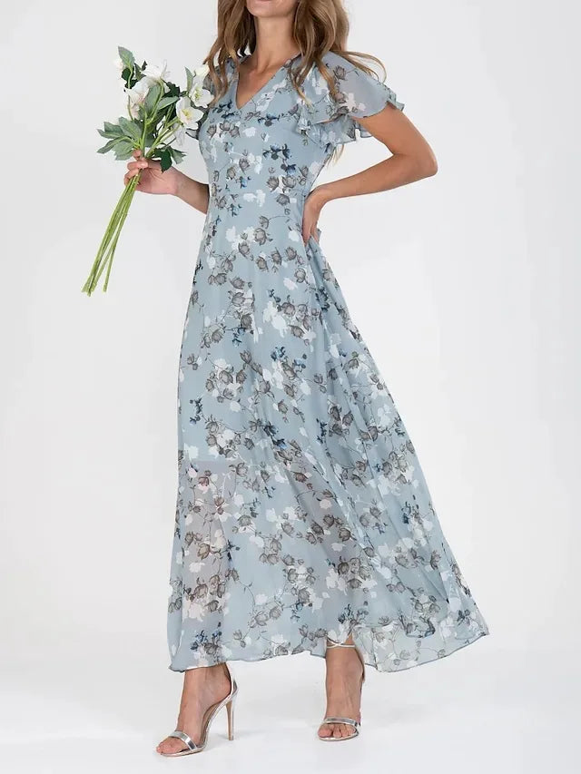 Robe longue fleurie fluide pour femme, style col en V. Idéale pour un look élégant et décontracté printemps/été.
