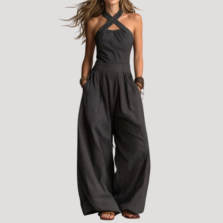 Combinaison femme élégante col halter croisé, pantalon large fluide. Parfaite pour une soirée chic ou une cérémonie.