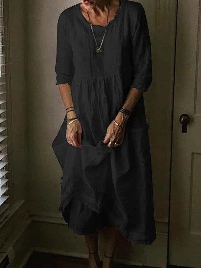 Élégante robe longue d'été femme, col rond, manches courtes, parfaite pour le confort et le style estival.
