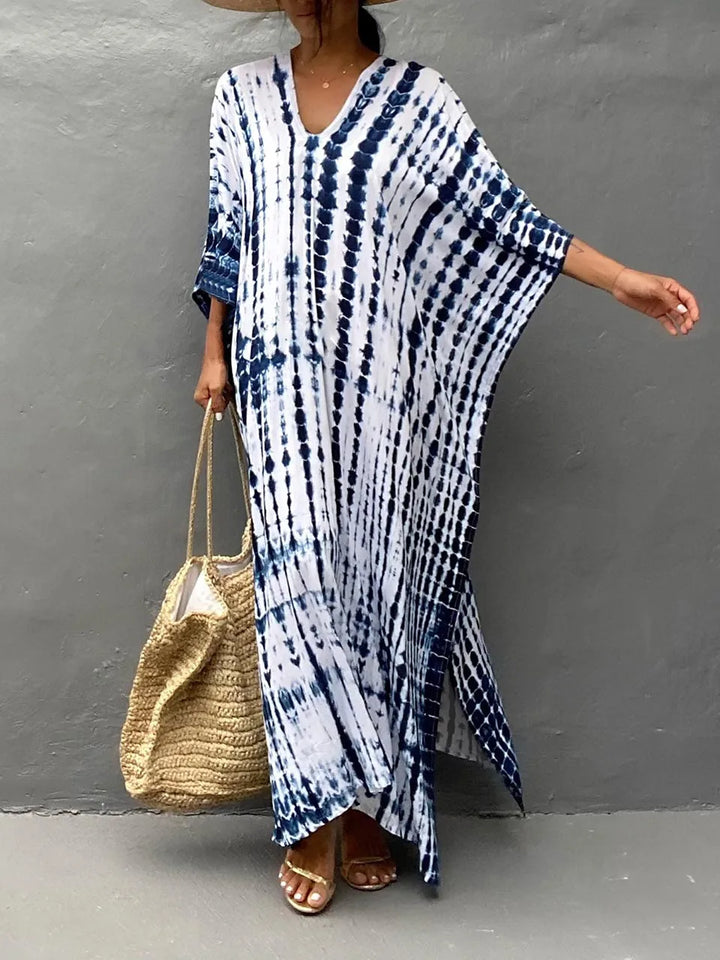 Maxi robe fluide caftan pour femme, style bohème chic, élégance estivale décontractée.