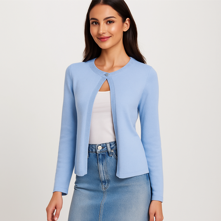 Cardigan femme coupe courte, élégant avec détails subtils, manches longues. Gilet chic pour mode printemps.