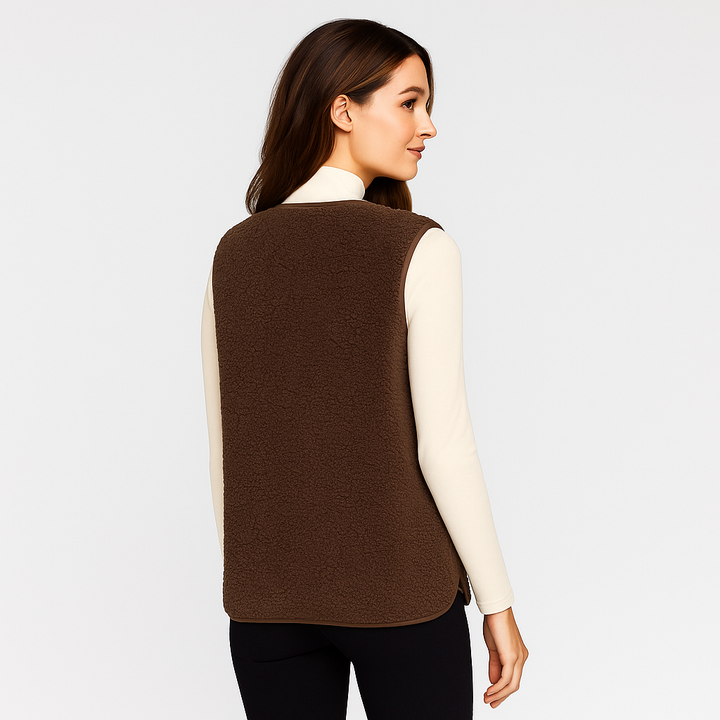 Gilet femme chic sans manches, élégant et confortable pour la mi-saison. Idéal pour une tenue moderne et polyvalente.
