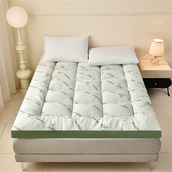 Profitez d'un sommeil réparateur avec le surmatelas King Size BambooDream, rafraîchissant et ergonomique.