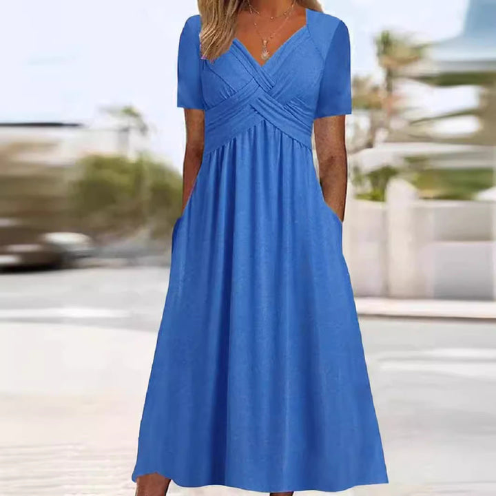 Robe longue fluide femme élégante, col V, manches courtes. Idéale pour l'été et les vacances.