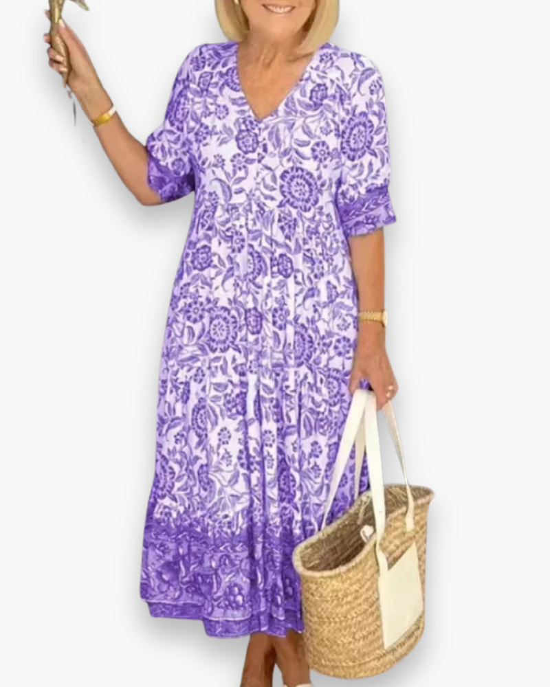 Robe femme élégante, coupe midi et imprimé fleuri. Un incontournable mode pour le printemps et l'été.