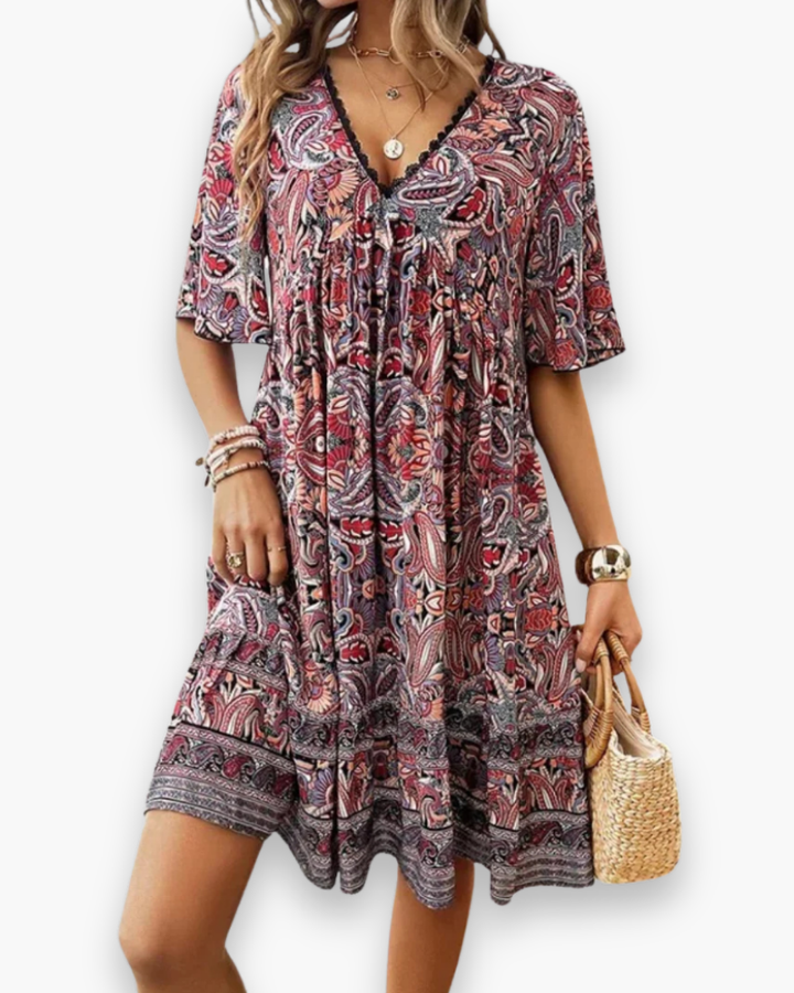 Vêtement femme : robe midi fluide élégante, coupe féminine et légère. Parfaite pour une allure chic en été.