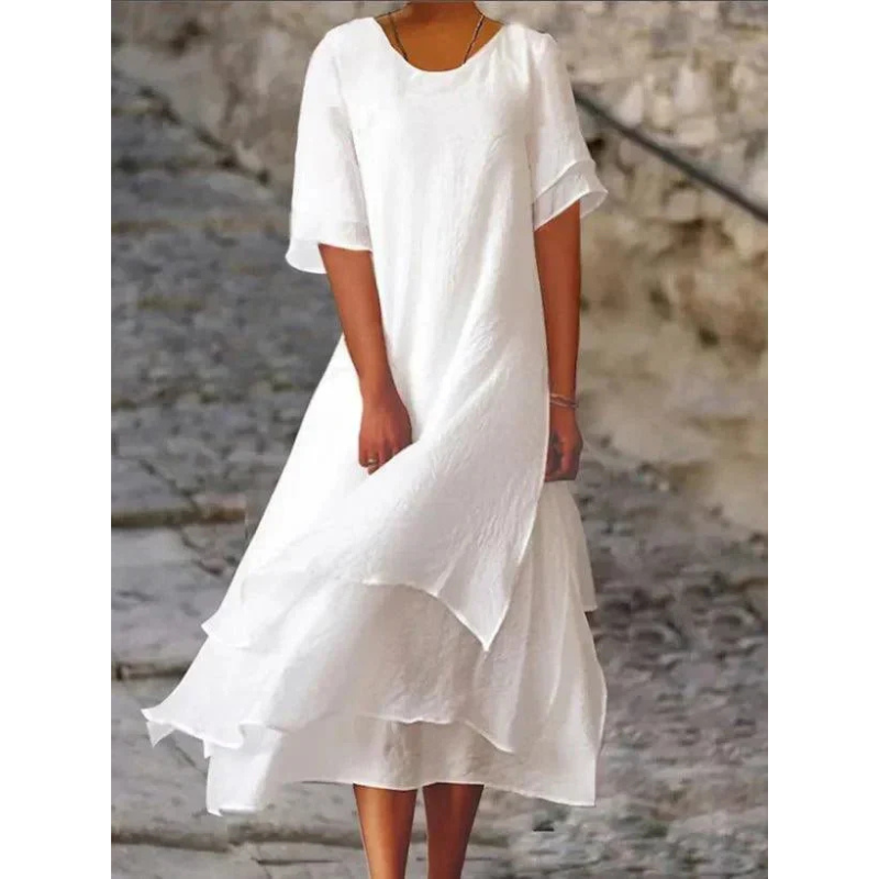 Robe polyvalente pour femme, style fluide et confortable, parfaite pour l'été ou une tenue chic décontractée.