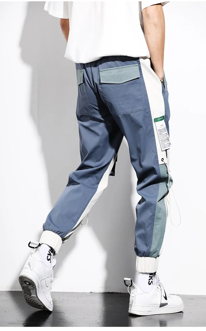 Pantalon cargo homme bicolore bleu, multi-poches fonctionnelles. Style urbain décontracté, parfait pour le streetwear.