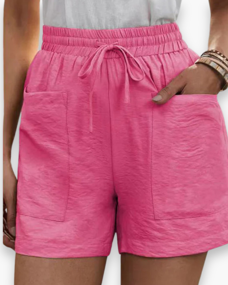 Short femme décontracté style estival avec taille élastique et poches, parfait pour la plage.