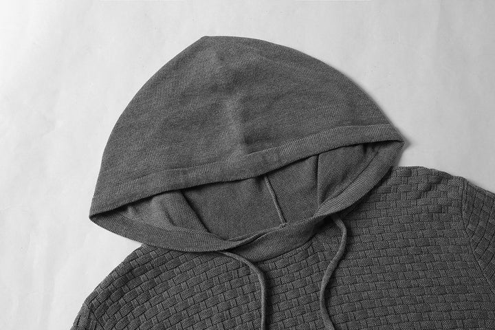 Pull à capuche bleu marine pour homme, style urbain, confort optimal et look décontracté.