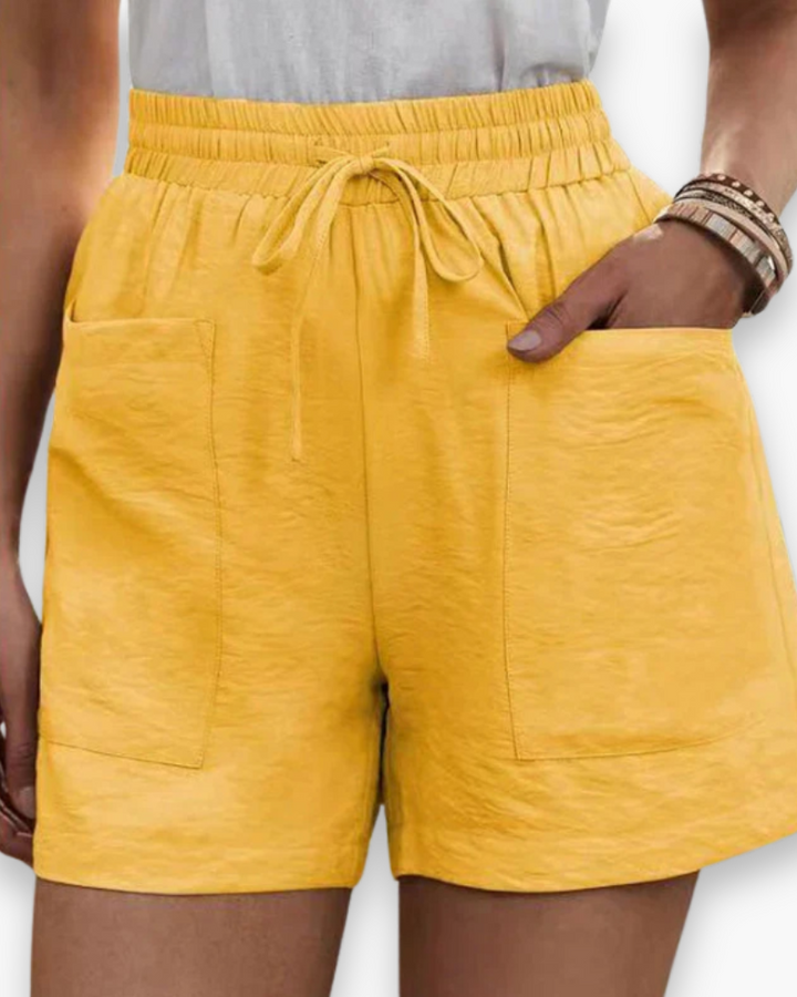 Short femme confortable à taille élastique, parfait pour l'été, la plage et les activités de loisirs.