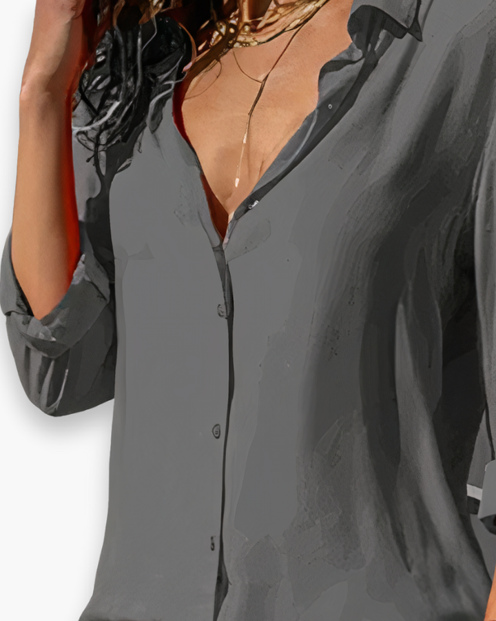 Blouse chic à manches longues pour femme, parfaite pour une tenue de bureau professionnelle et élégante.