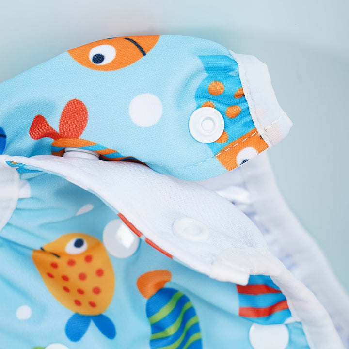 Culotte de bain bébé imperméable et réutilisable, réglable. Motifs animaux de la mer.