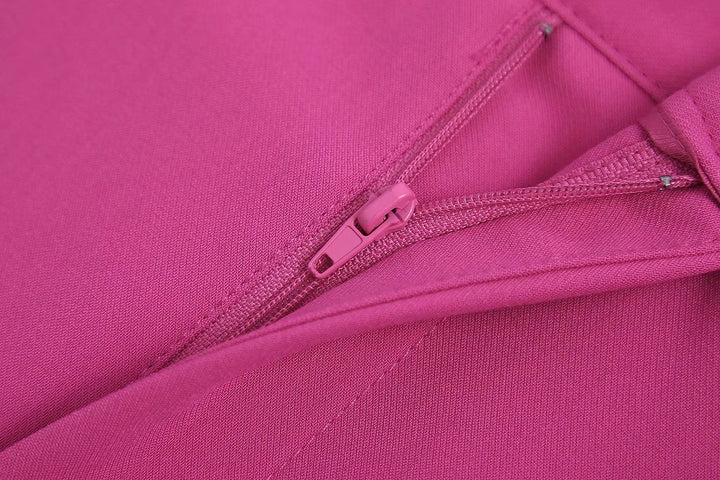 Ensemble femme chic: blazer et pantalon rose, parfait pour des événements professionnels ou élégants.