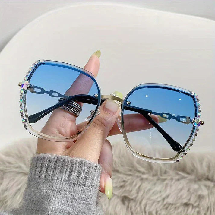 Lunettes de soleil femme sans monture, cristaux scintillants, verres dégradés pour protection UV chic.