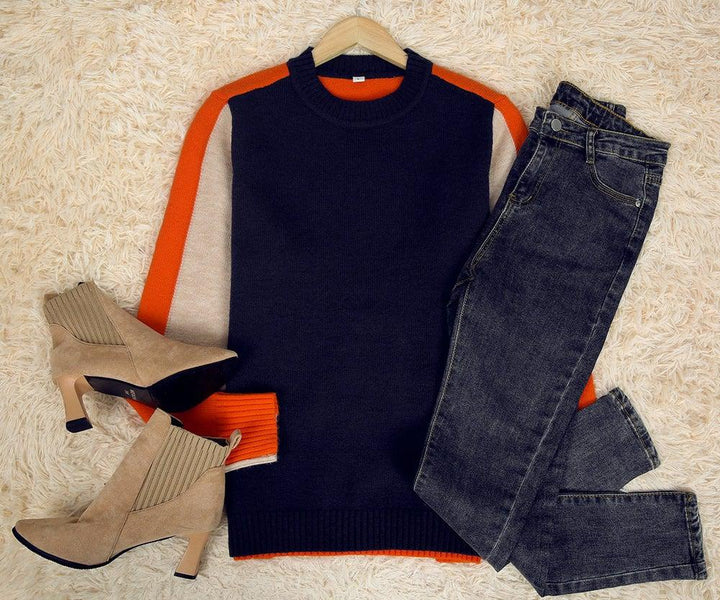 Pull femme rayé pour un look urbain chic, vêtement moderne et confortable, style graphique et coupe ajustée.