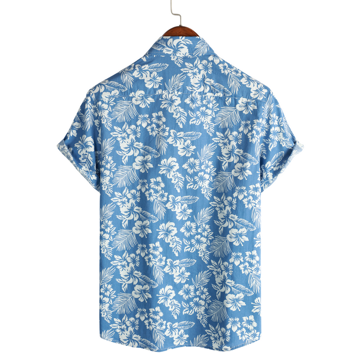Chemise homme tropicale légère et respirante, motif fleuri coloré, parfaite pour un style d'été décontracté.